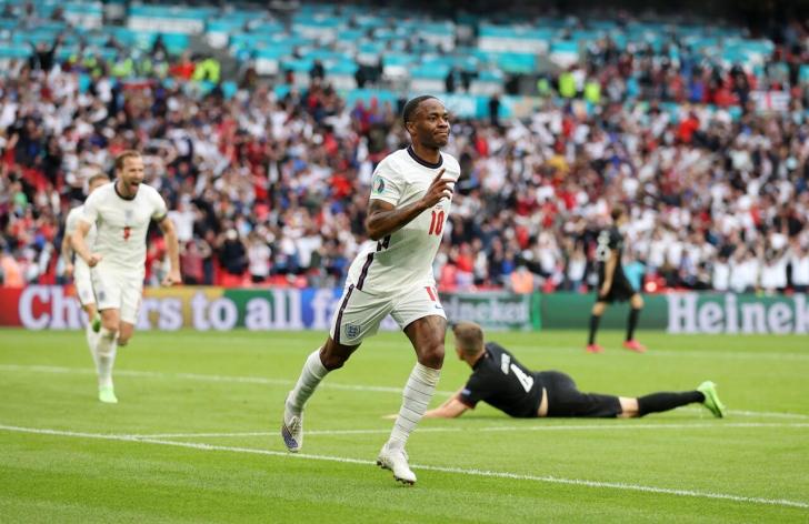 Raheem Sterling celebrates scoring for England
